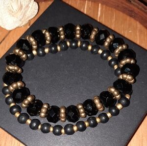Pair black and gold beaded stretch bracelets wood and crystal